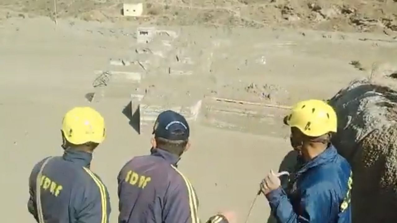 Rescue personnel work at the site of a flood caused by an avalanche in Uttarakhand's Chamoli. Credit: Twitter/@chamolipolice.