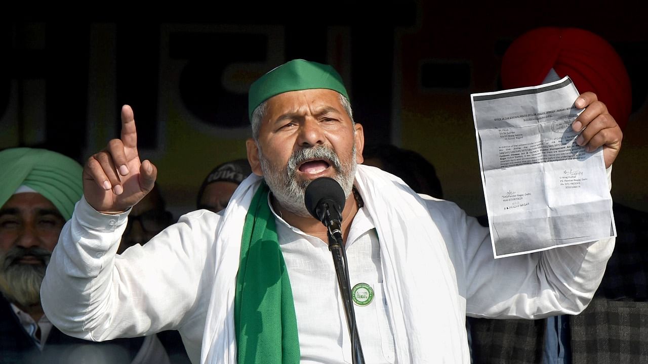 BKU spokesperson Rakesh Tikait addresses during the 'chakka jam' by farmers, in solidarity with the ongoing agitation against Centre's farm reform laws, at Ghazipur border in New Delhi. Credit: PTI Photo