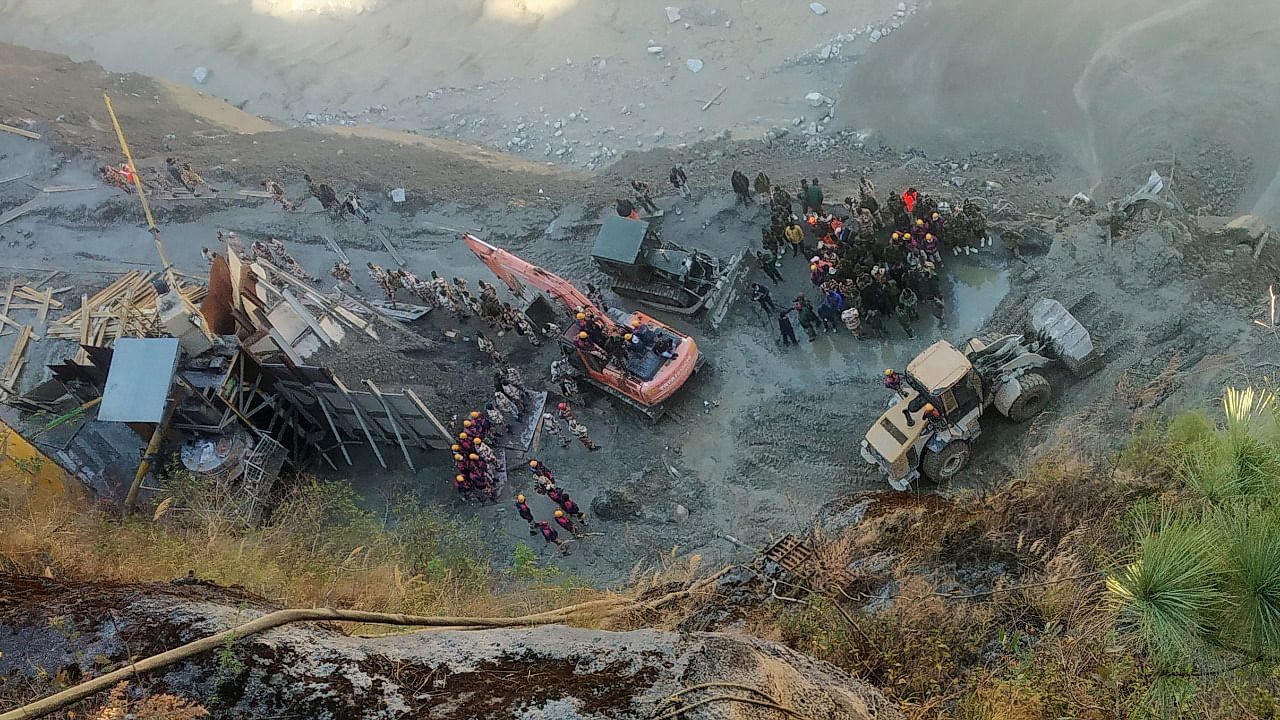 Rescue team members work near a tunnel after a part of a glacier broke away and caused flood in Tapovan, northern state of Uttarakhand. Credit: Reuters Photo