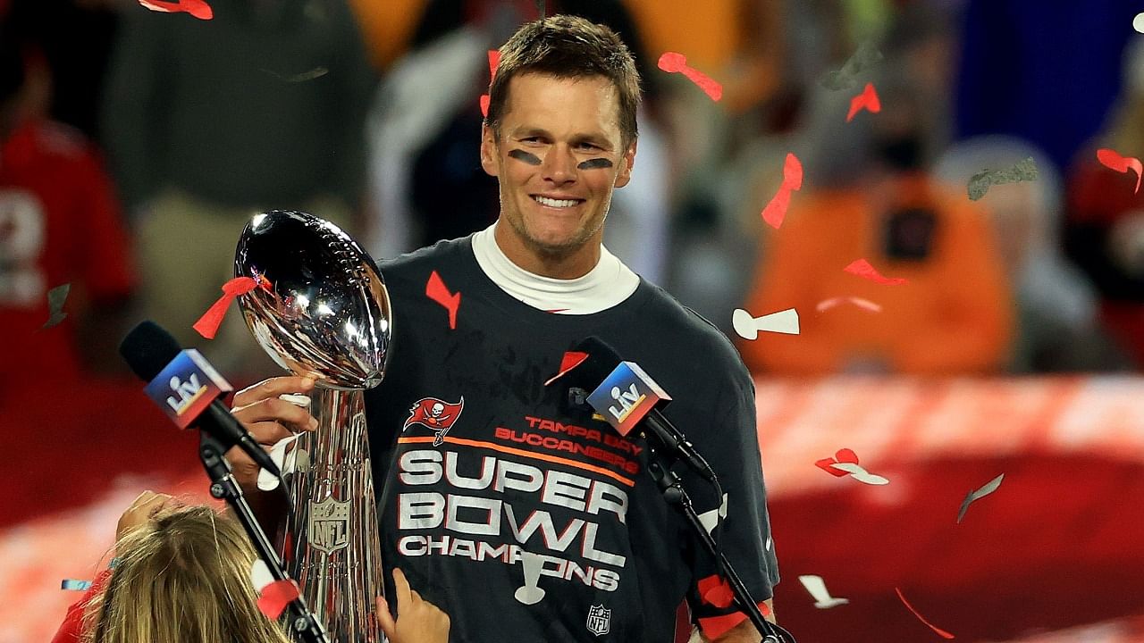 Tom Brady #12 of the Tampa Bay Buccaneers hoists the Vince Lombardi Trophy after winning Super Bowl LV at Raymond James Stadium in Tampa Bay. Florida. Credit: AFP Photo.