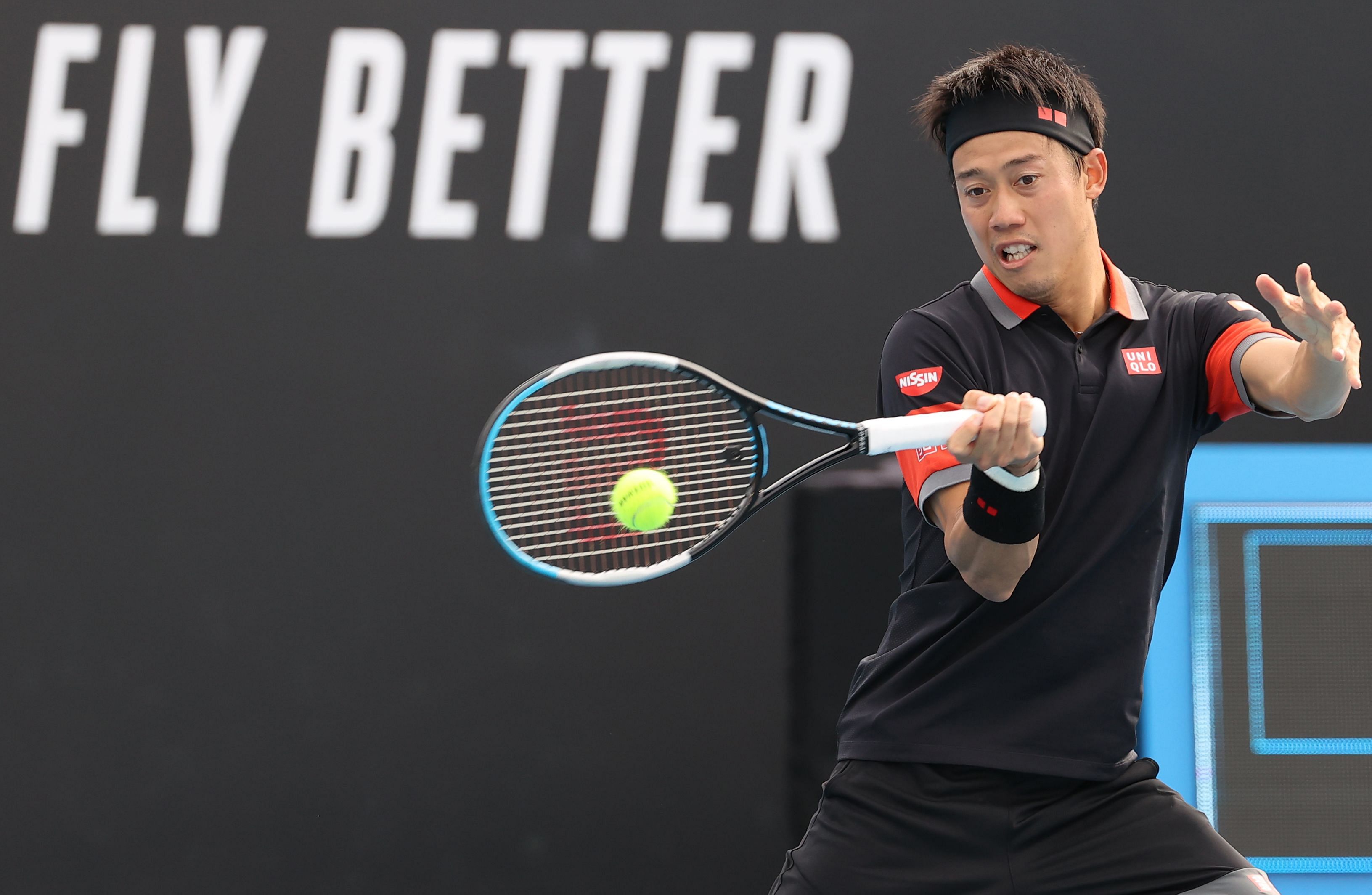 Japan's Kei Nishikori hits a return against Spain's Pablo Carreno Busta during their men's singles match on day one of the Australian Open tennis tournament in Melbourne on February 8, 2021. Credit: AFP
