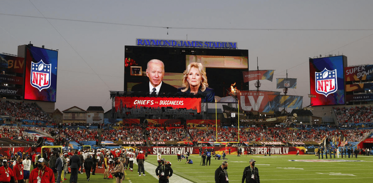 U.S. President Joe Biden and first lady Dr. Jill Biden seen delivering a message on the big screen before the game. Credit: Reuters Photo
