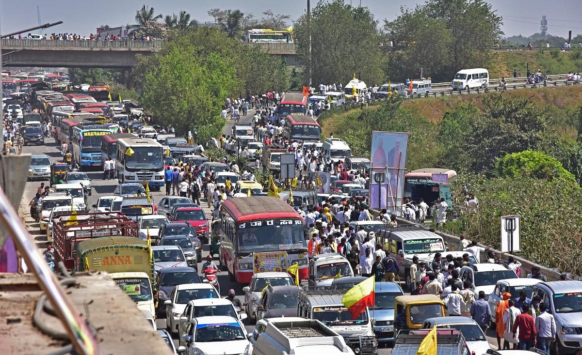 A massive traffic jam on Chennai-Mumbai National Highway and NICE Road due to the Kuruba rally at the BIEC.