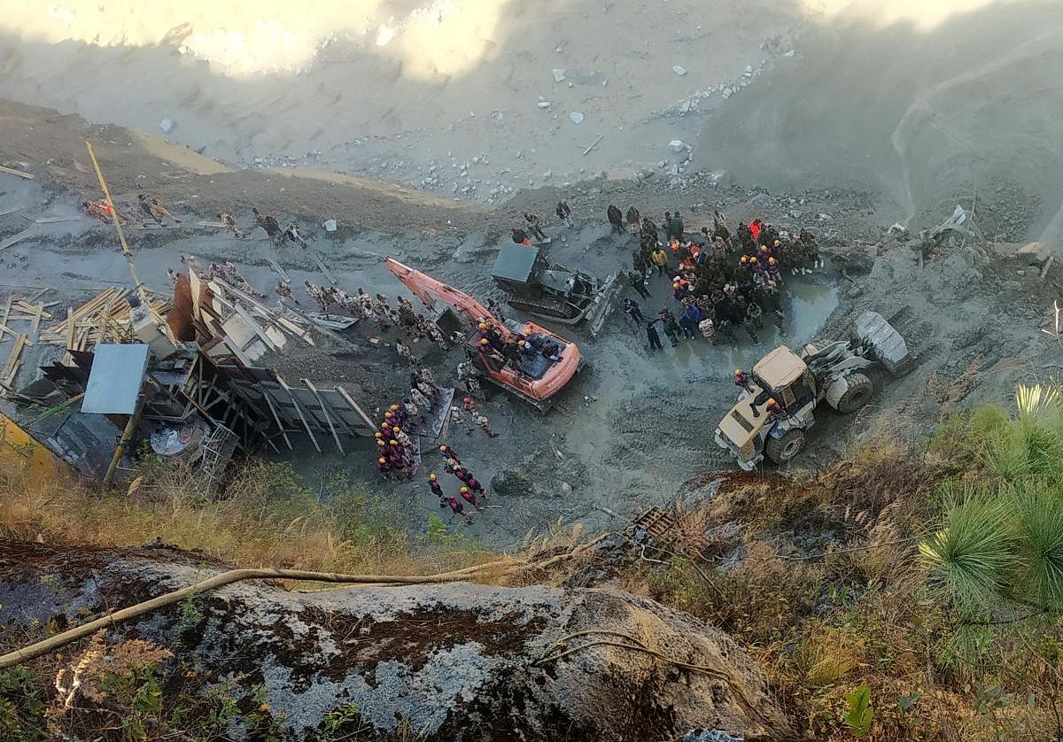 Rescue team members work near a tunnel after a part of a glacier broke away and caused flood in Tapovan, northern state of Uttarakhand, India, February 8, 2021. Credit: Reuters photo. 