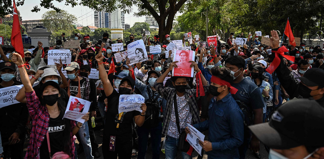 Protesters hold signs demanding the release of detained Myanmar leader Aung San Suu Kyi during a demonstration against the military coup in Yangon. Credit: AFP Photo