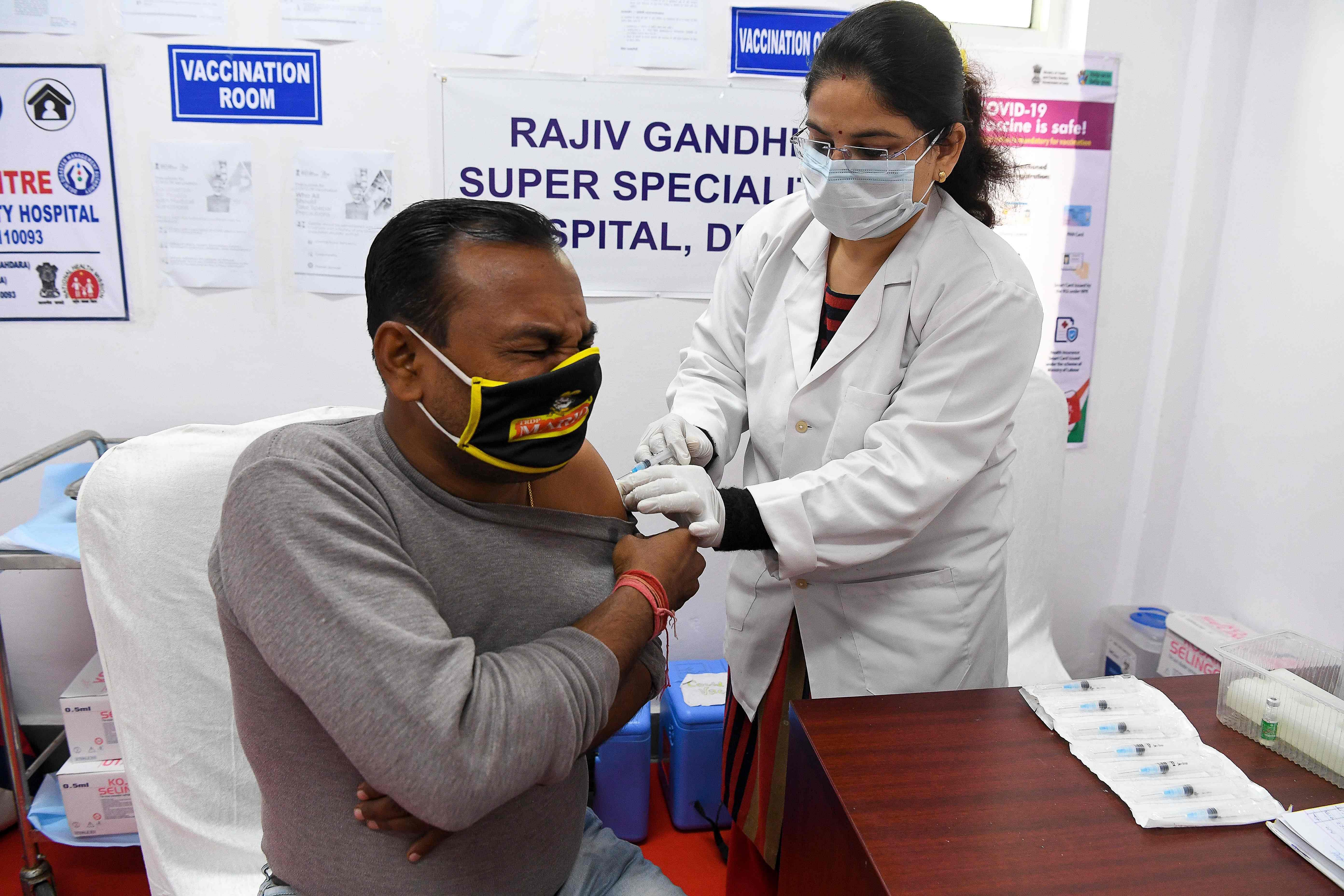 A medical worker inoculates a medical staff with a Covid-19 coronavirus vaccine at Rajiv Gandhi Super speciality hospital in New Delhi on February 9, 2021. Credit: AFP Photo