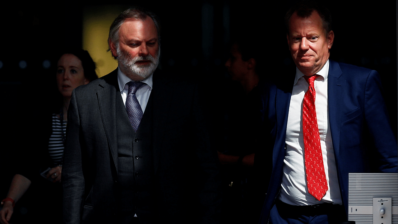 Britain's ambassador to the EU, Barrow, and British PM Johnson's Europe adviser, Frost, leave the EU Commission headquarters in Brussels. Credit: Reuters Photo