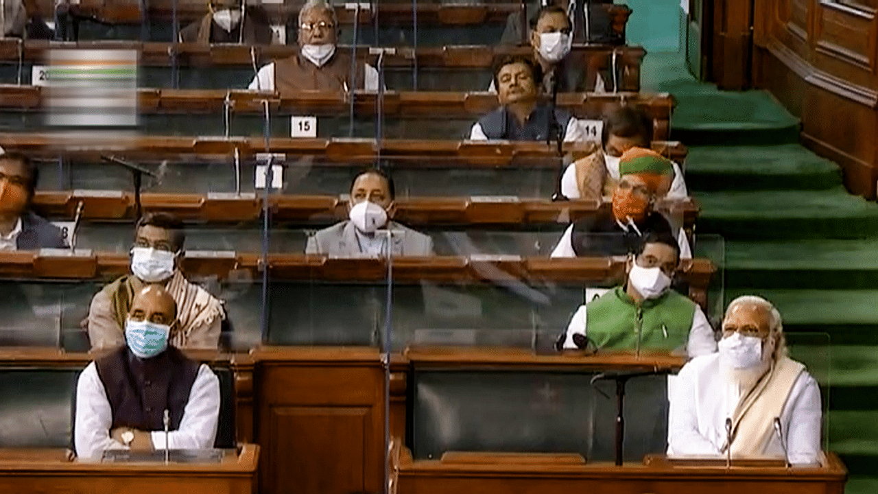 Prime Minister Narendra Modi and Defence Minister Rajnath Singh in the Lok Sabha during ongoing Budget Session of Parliament. Credit: PTI Photo
