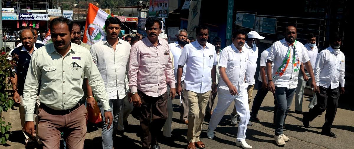 Somwarpet Block Congress committee members take out a protest rally in the town on Monday.