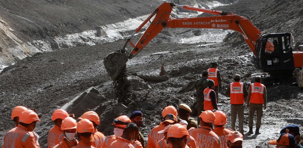 Members of the National Disaster Response Force (NDRF) conduct a rescue operation outside a tunnel after a part of a glacier broke away, in Tapovan in Uttarakhand. Credit: Reuters photo. 