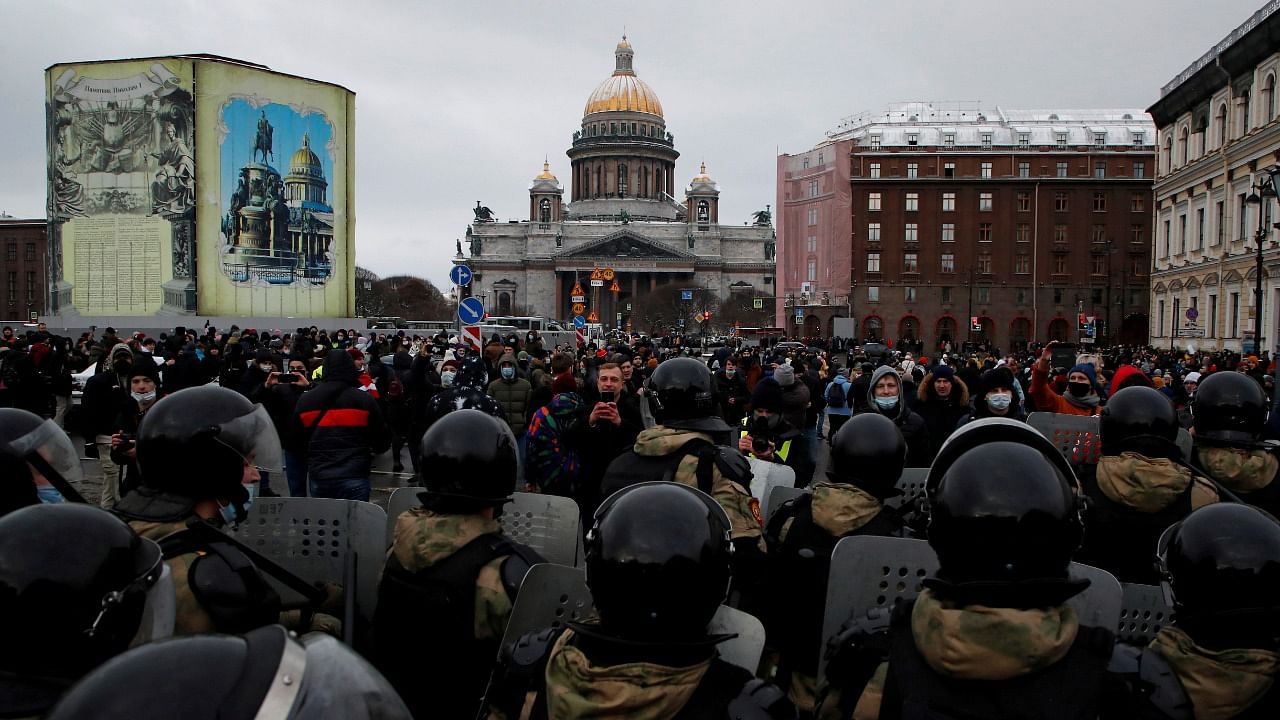 Demonstrators stand in front of law enforcement officers during a rally in support Navalny in Saint Petersburg, Russia. Credit: Reuters Photo