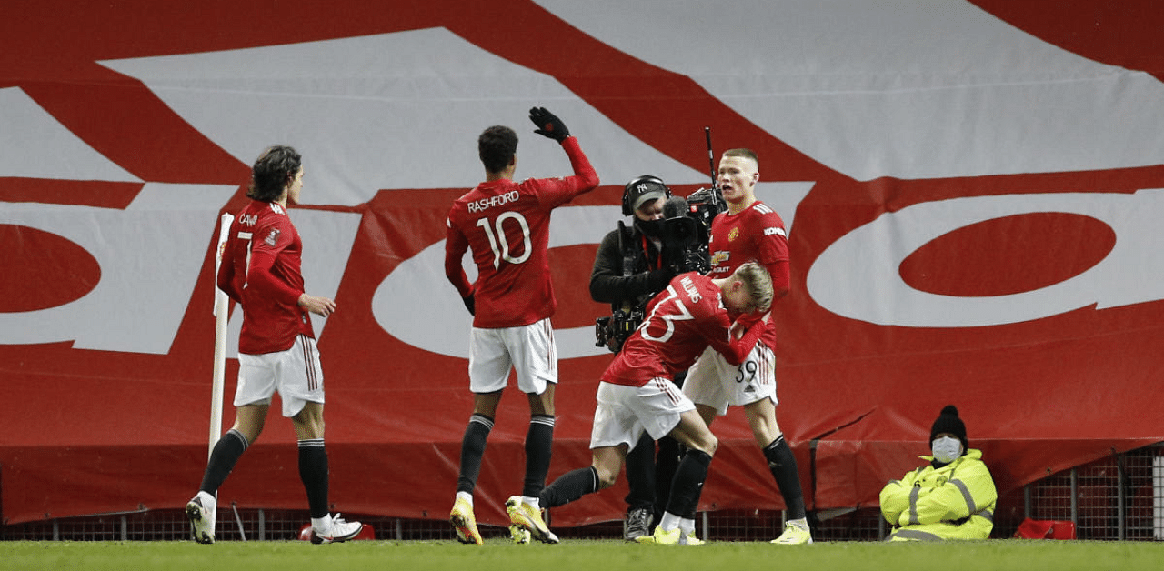 Manchester United's Scott McTominay celebrates scoring their first goal with teammates. Credit: Reuters Photo