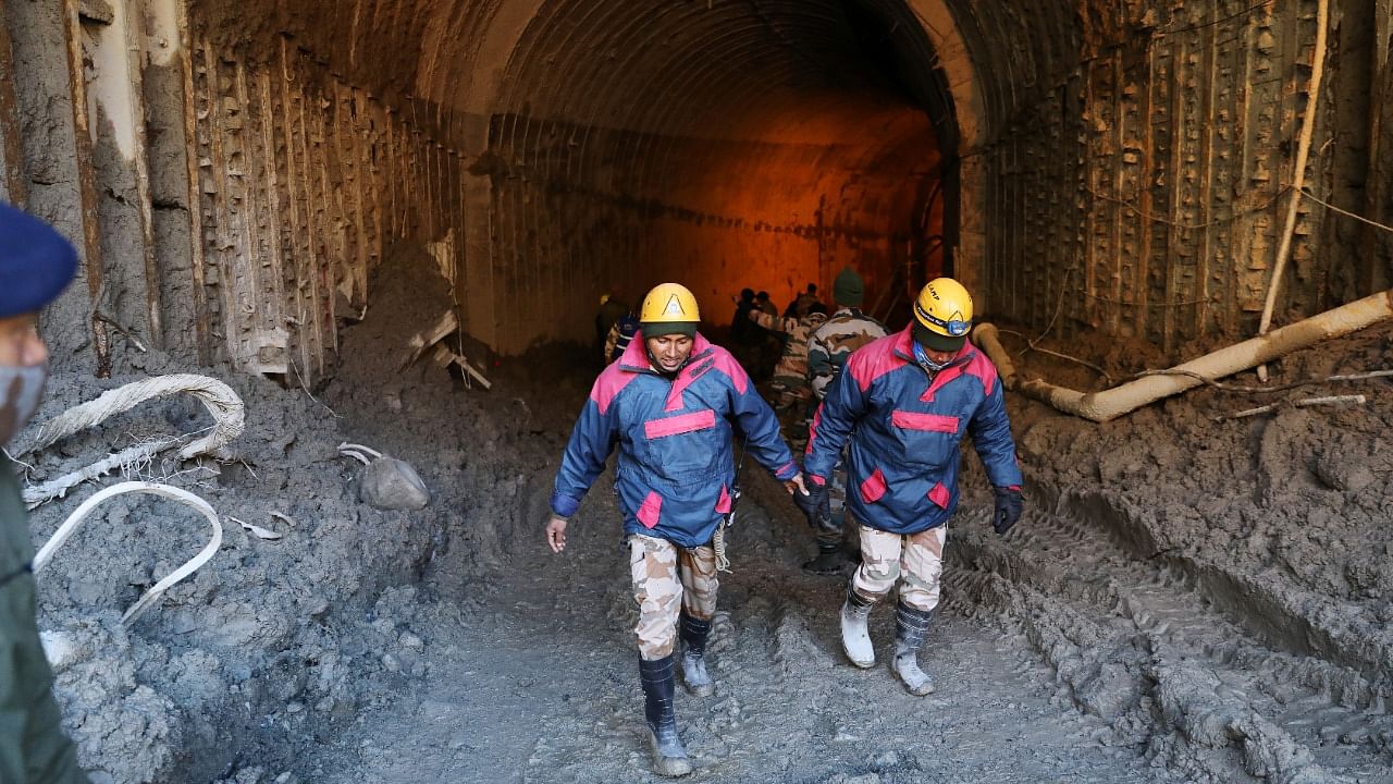 Members of a rescue team work inside a tunnel after a part of a glacier broke away in Tapovan, in Uttarakhand, India, February 11, 2021. Credit: Reuters Photo