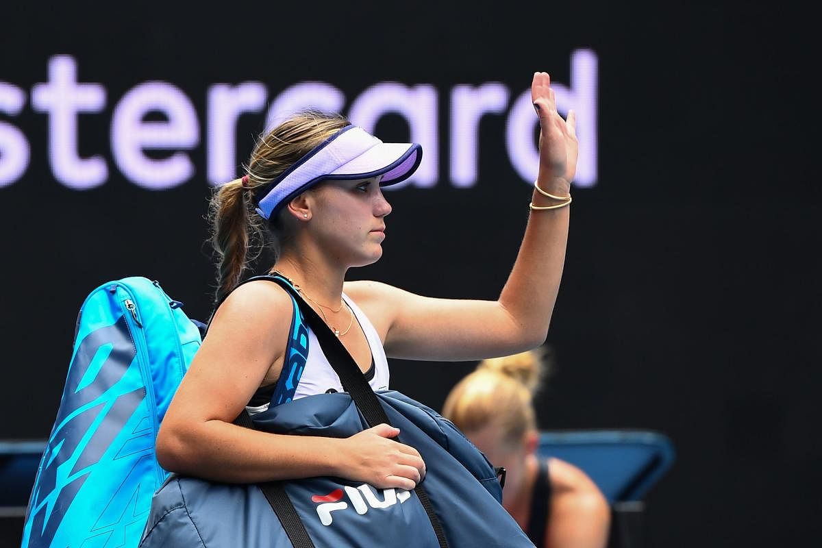 Sofia Kenin of the US leaves after losing against Estonia's Kaia Kanepi during their women's singles match on day four of the Australian Open tennis tournament in Melbourne on February 11, 2021. Credit: AFP photo. 