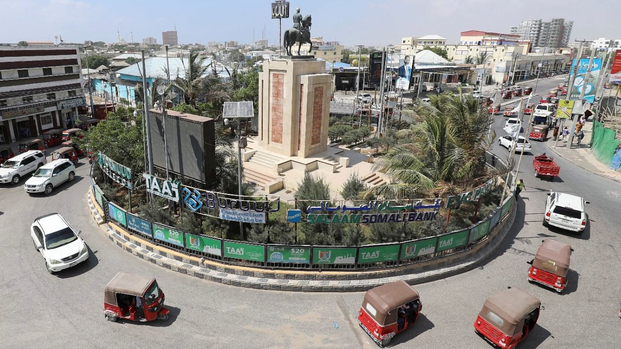 Rickshaw taxis drive past the Ahmed Gurey monument at the KM4 roundabout in Mogadishu. Representative Image. Credit: Reuters Photo