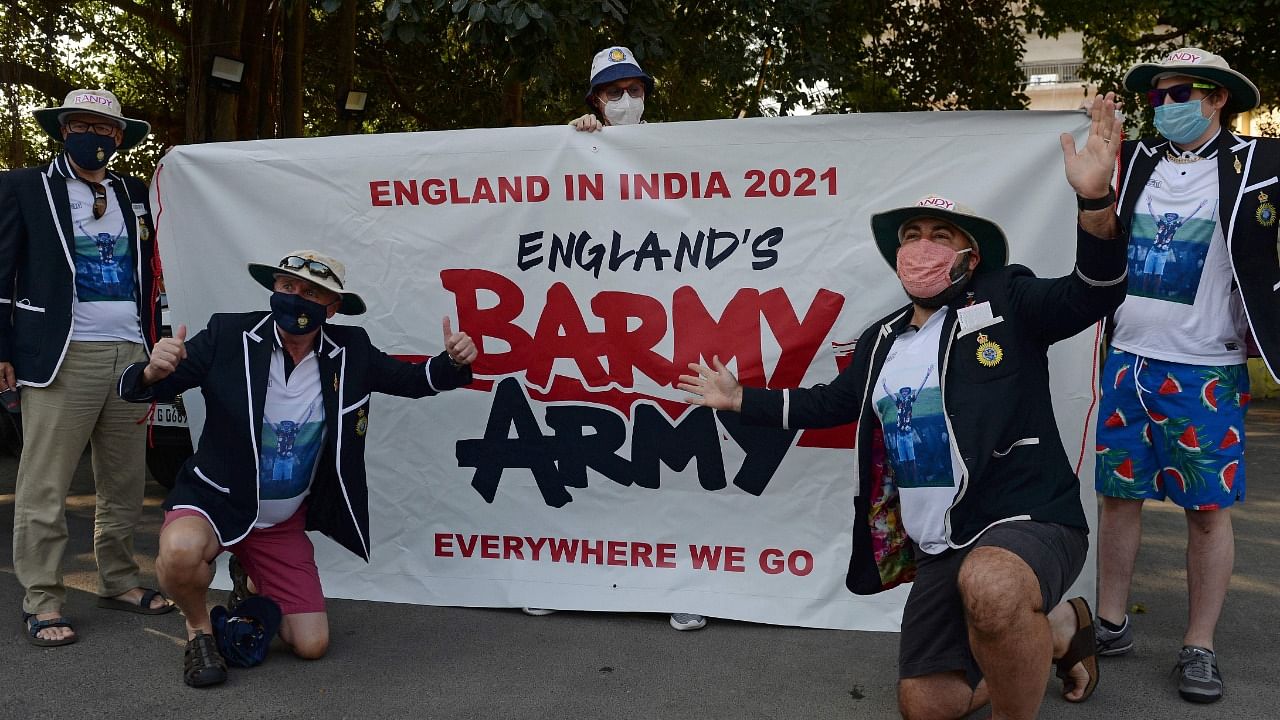 Members of the England cricket team fan group 'Barmy Army' rejoice before the second Test between India and England in Chennai. Credit: AFP Photo.