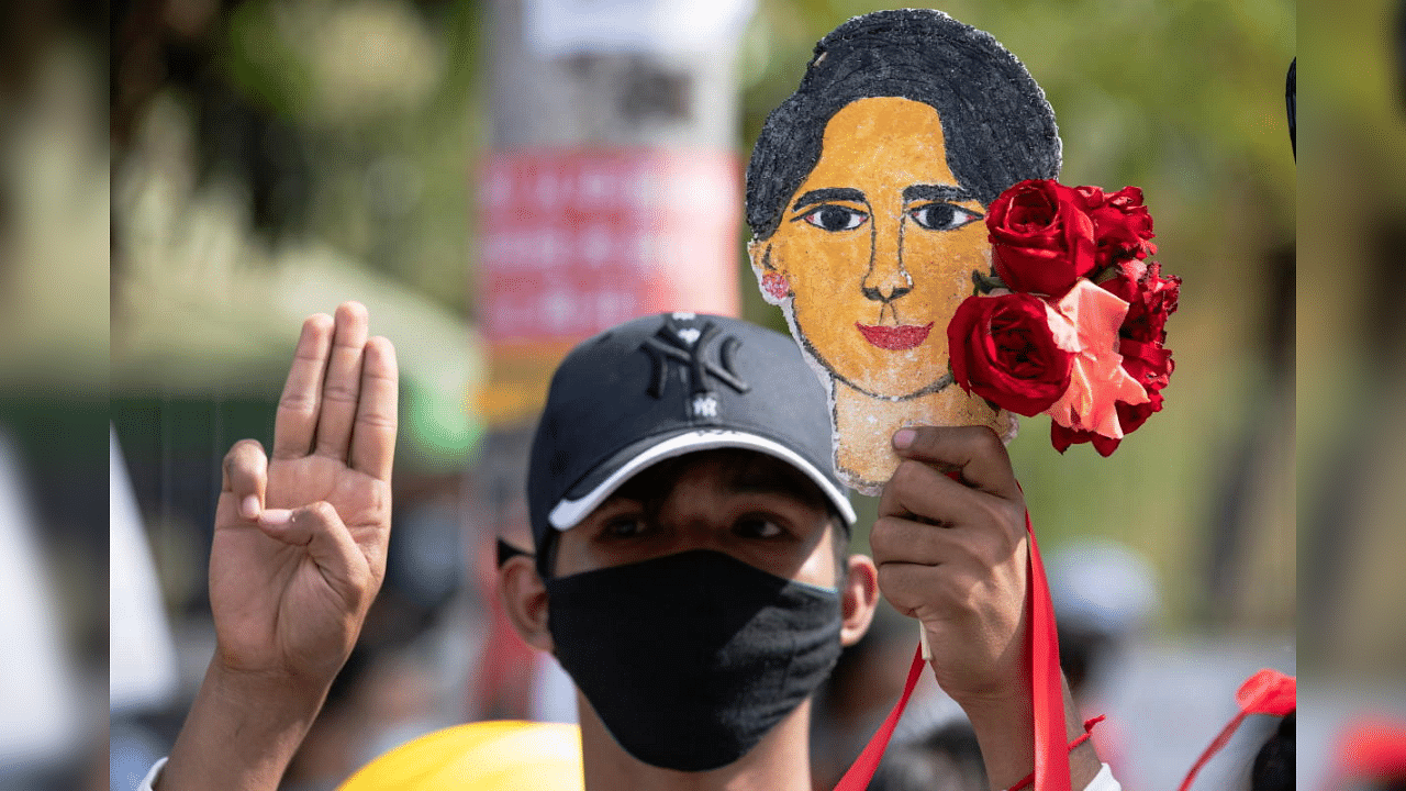 A demonstrator flashes a three-finger salute during a protest against the military coup and to demand for the release of elected leader Aung San Suu Kyi, in Yangon, Myanmar, February 12, 2021. Credit: Reuters Photo
