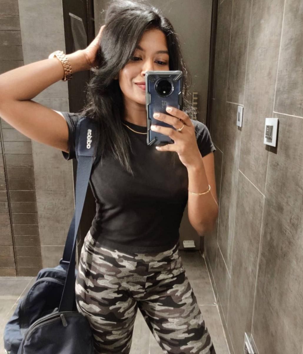 A capsule closet consists of good quality basics that can be made versatile by mixing and matching to suit your needs. (Above) Karthika Anand wore the same black crop top to the gym and on a day out.