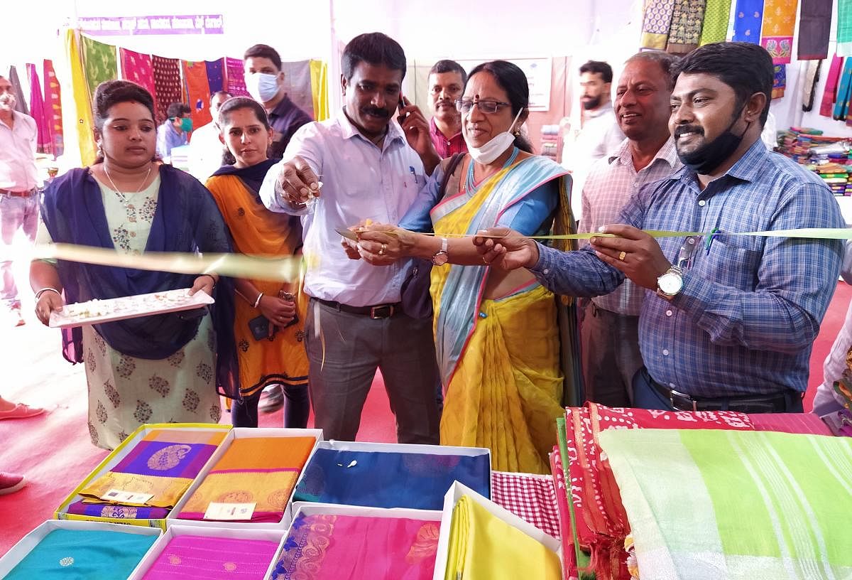 Zilla Panchayat president B A Harish and vice president Lokeshwari Gopal inaugurate the handloom products exhibition-cum-sale at Gandhi Maidan in Madikeri.