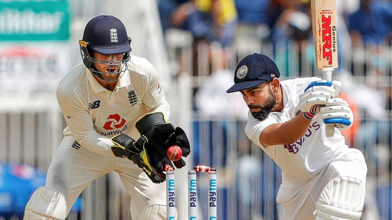 Indian Captain Virat Kohli is bowled out by England's Moeen Ali during the 1st day of the second cricket test match between India and England, at M.A. Chidambaram Stadium, in Chennai. Credit: PTI Photo.