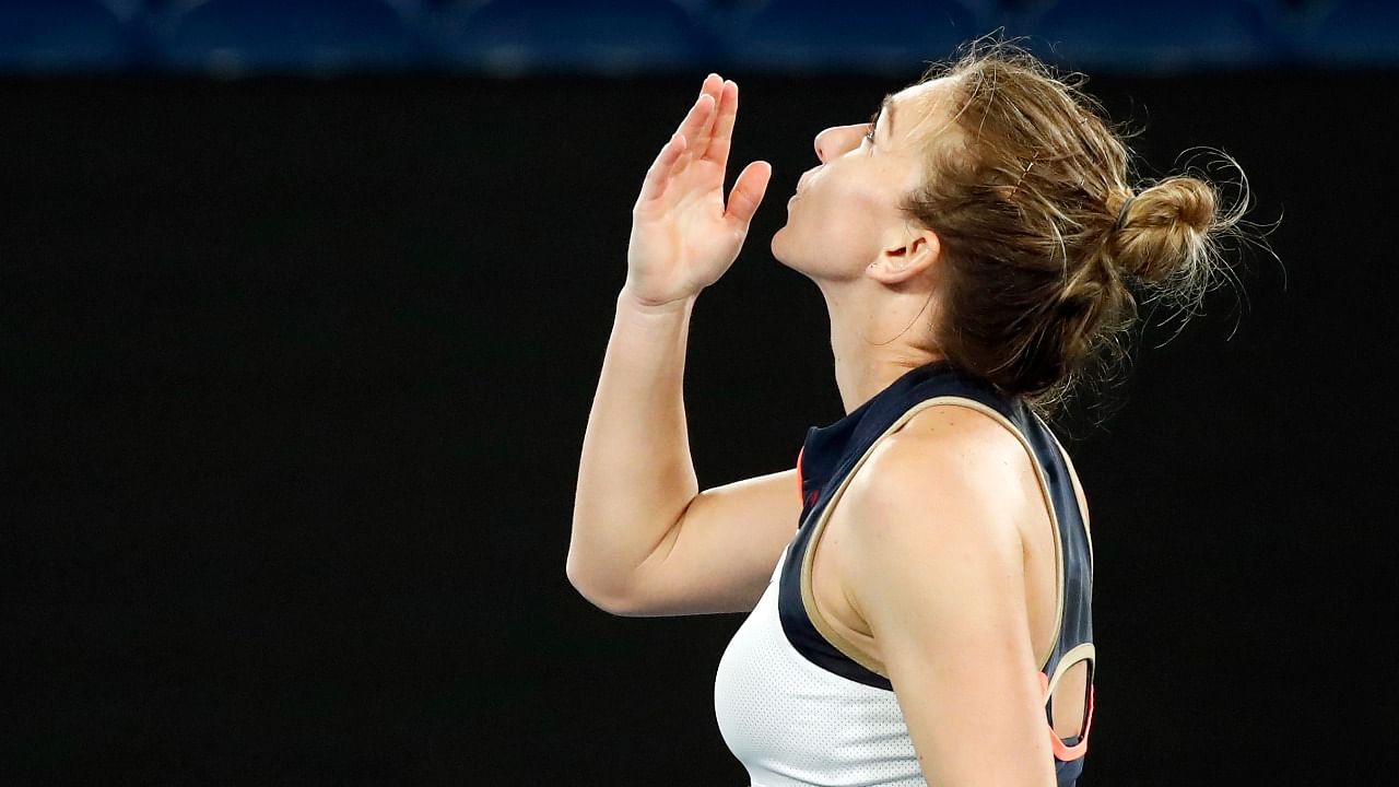 Romania's Simona Halep celebrates winning her fourth round match against Poland's Iga Swiatek. Credit: Reuters Photo