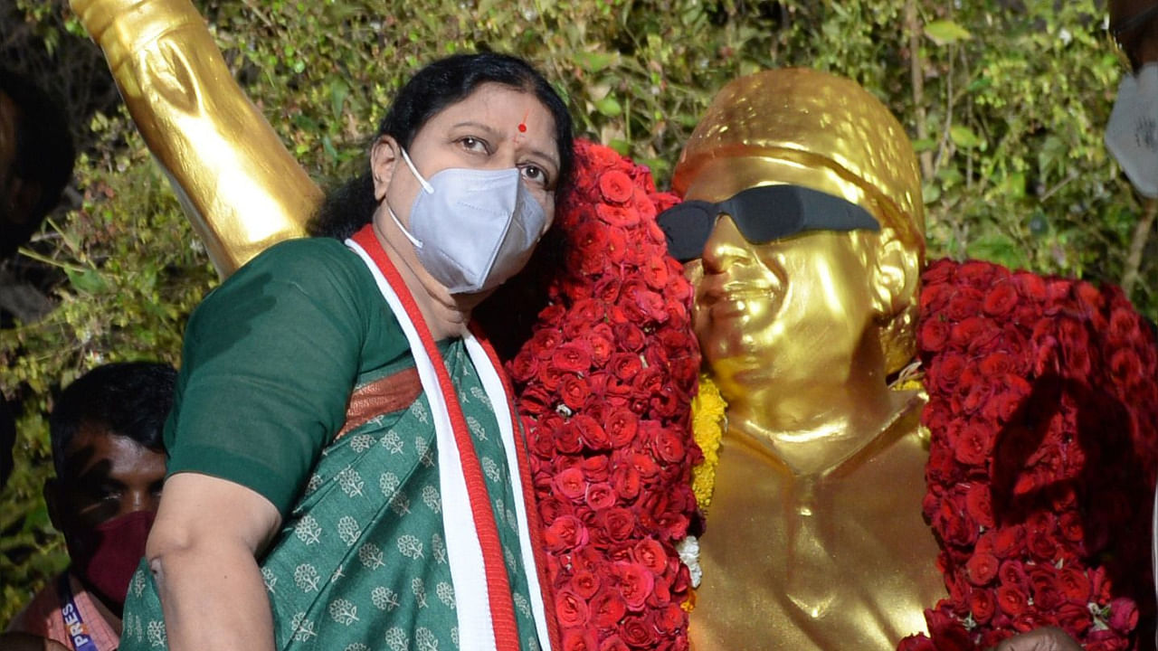 V.K. Sasikala (L), who in 2017 was expelled from her leadership position in the All India Anna Dravida Munnetra Kazhagam (AIADMK) party and recently released from prison after serving a four-year sentence for corruption, pays homage at the statue of AIADMK party founder M.G. Ramachandran in Chennai. Credit: AFP Photo