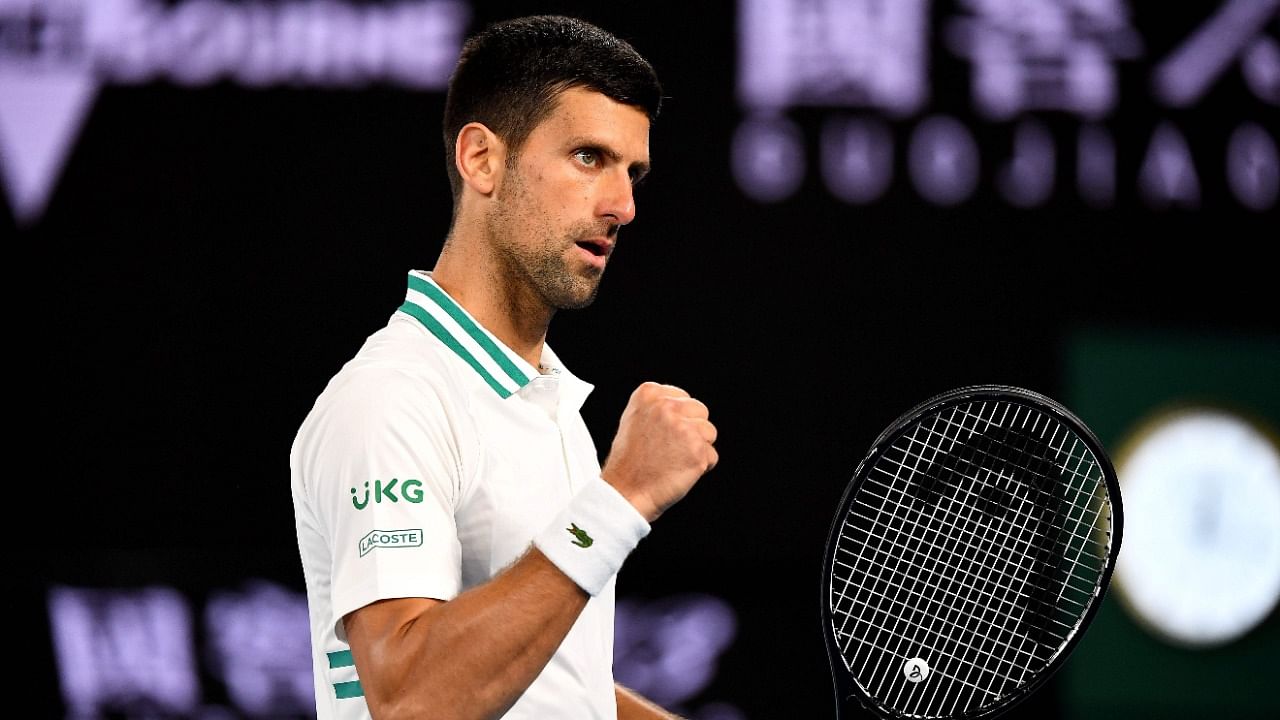 Top-seed Novak Djokovic saw off Milos Raonic in the fourth round of the Australian Open despite an injury scare. Credit: AFP Photo.
