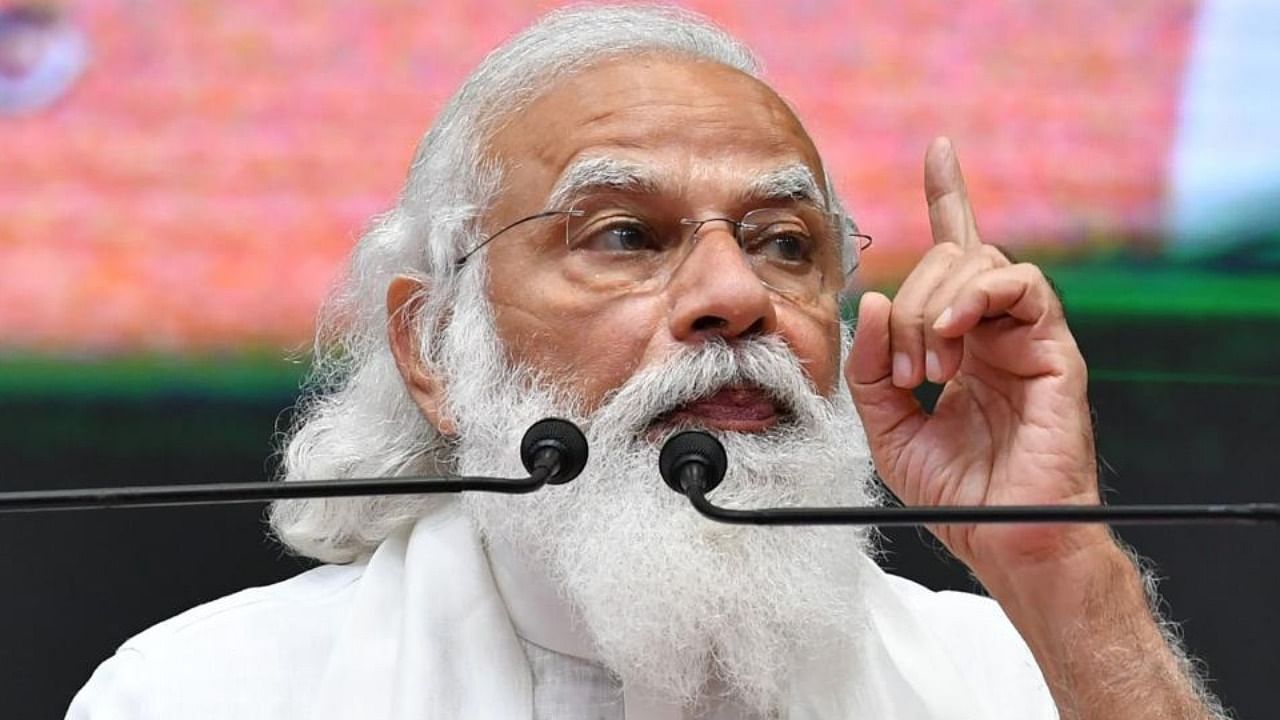 Prime Minister Narendra Modi gestures as he addresses a gathering in Chennai. Credit: AFP Photo