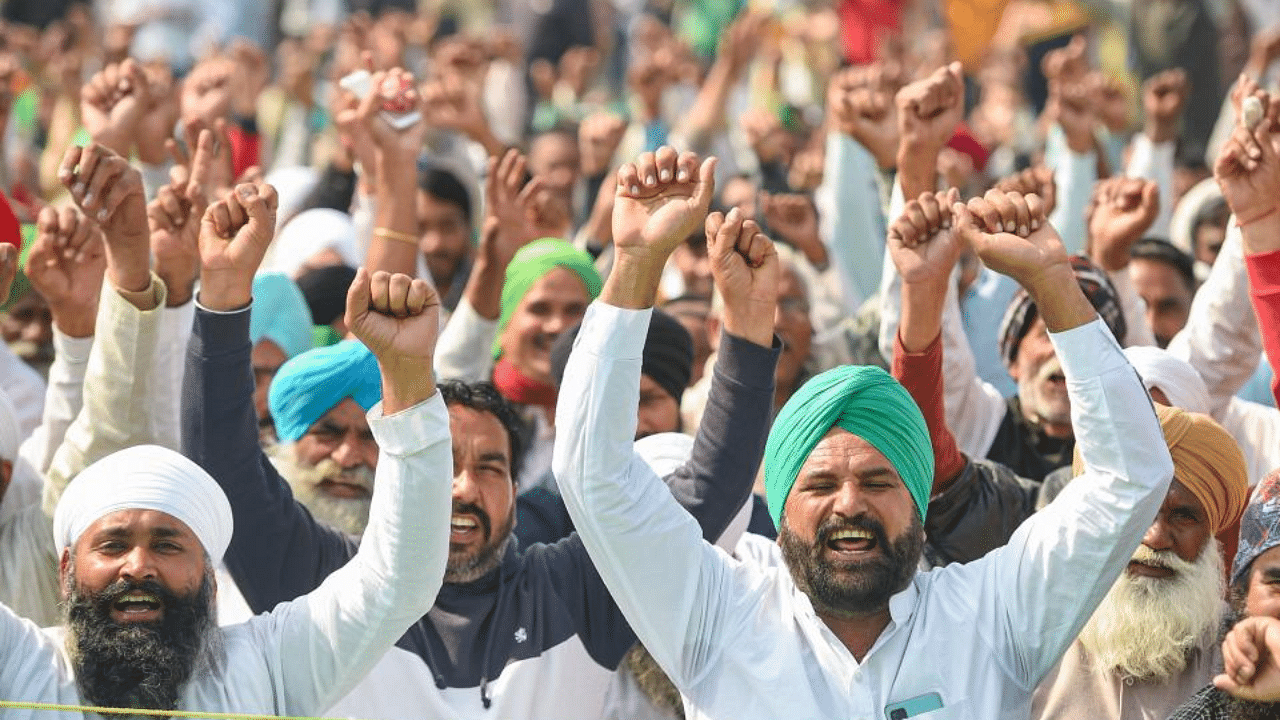 Farmers raise slogans during their protest against new farm laws, at Ghazipur border in New Delhi, Wednesday, Feb. 10, 2021. Credit: PTI Photo