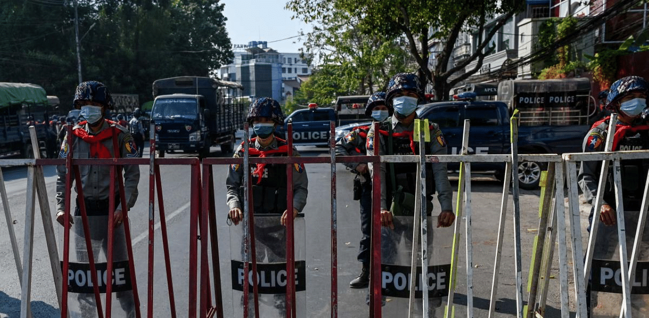 Police block the street leading to the headquarters of the National League for Democracy (NLD) in Yangon. Credit: AFP Photo