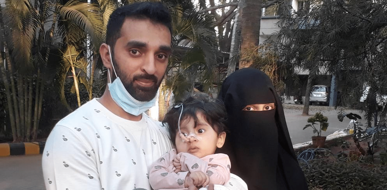 Mohammed Basil and Khadija with their 14-month old daughter Fatima. Credit: PTI Photo