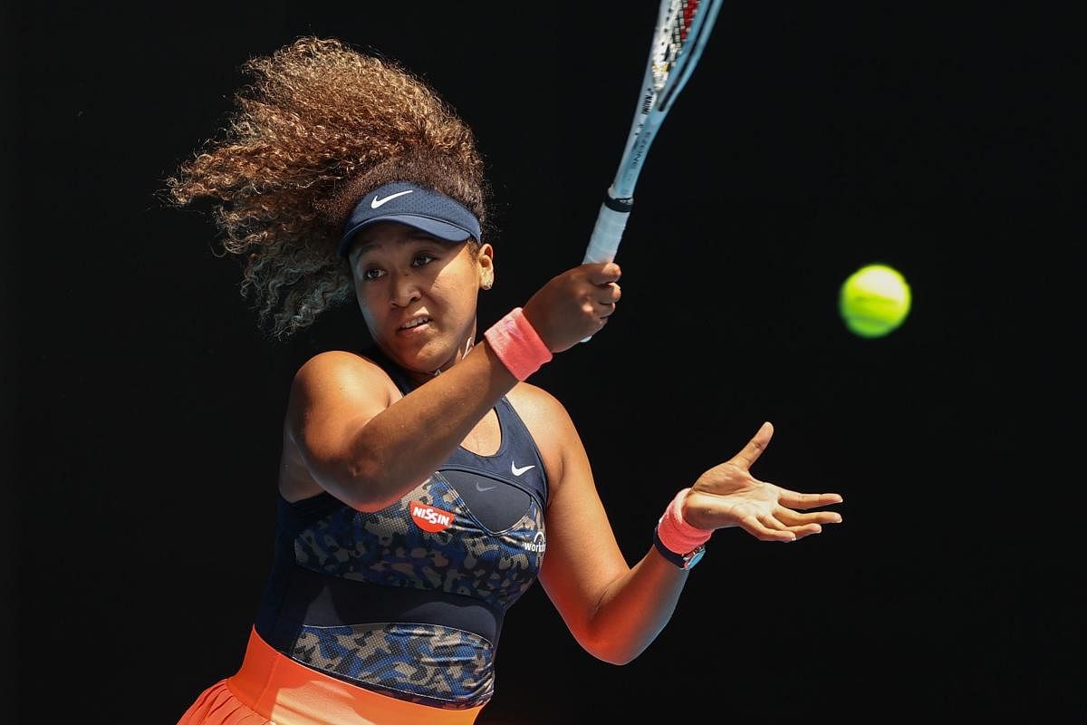 Japan's Naomi Osaka hits a return against Taiwan's Hsieh Su-wei during their women's singles quarter-final match on day nine of the Australian Open tennis tournament in Melbourne on February 16, 2021. Credit: AFP photo.