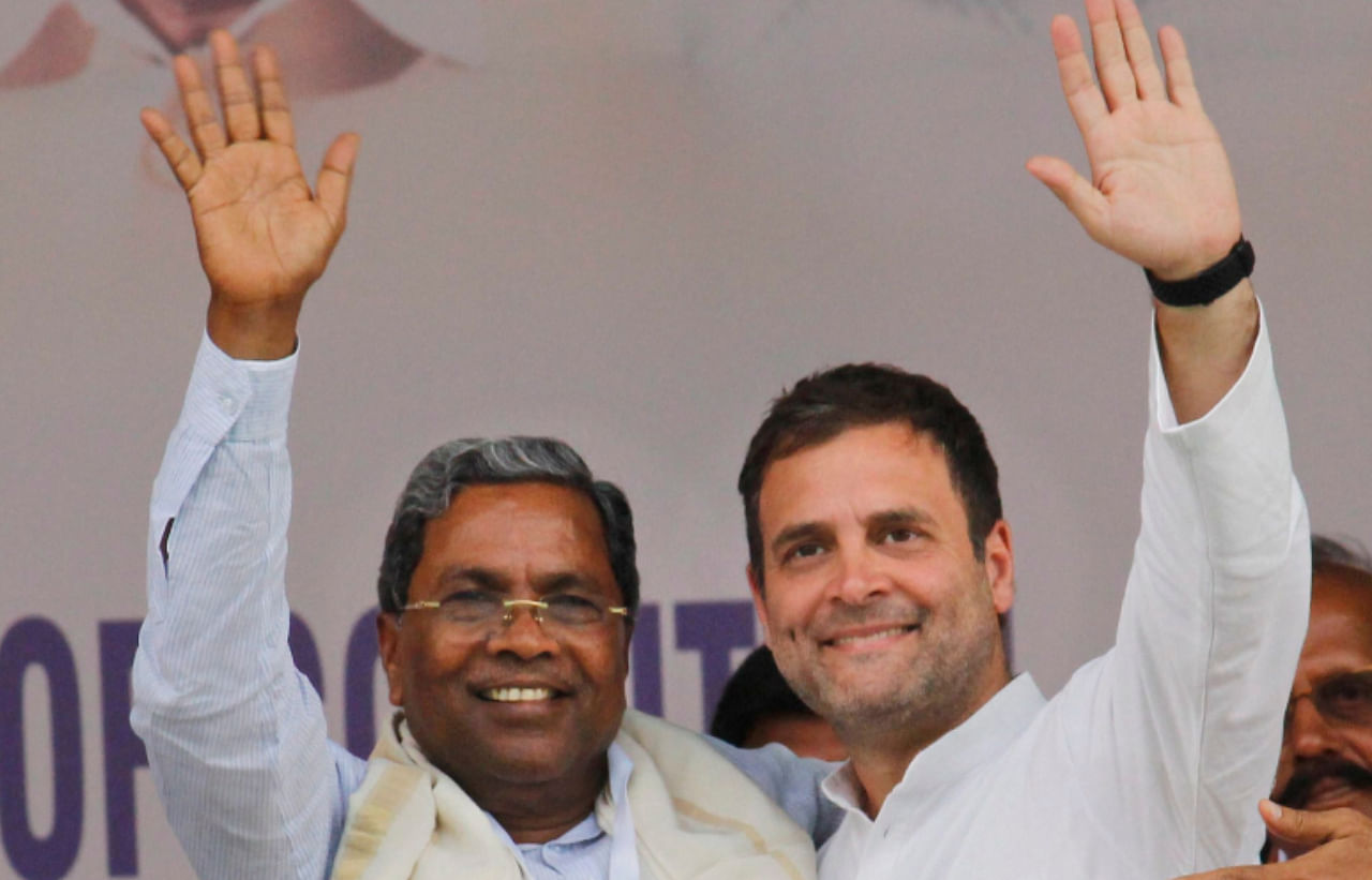 Congress former President Rahul Gandhi with party leader Siddaramaiah. Credit: PTI File Photo