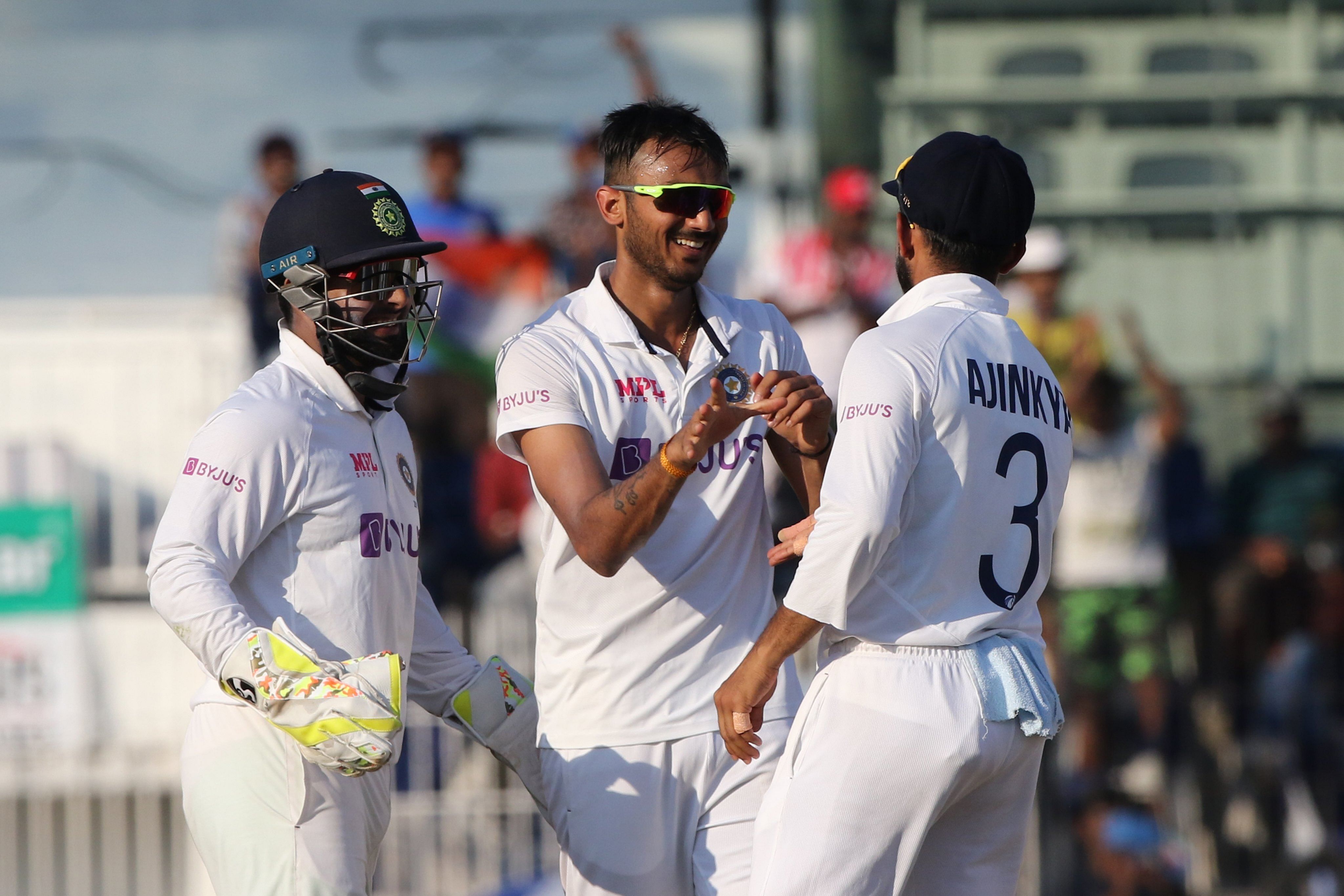 Axar Patel celebrates taking the wicket of Joe Root. Credit: BCCI twitter.