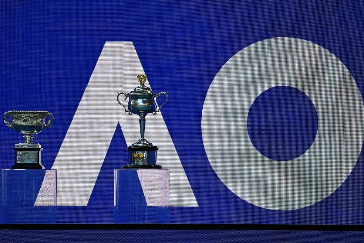 The men's (L) and women's singles trophies are displayed on day ten of the Australian Open tennis tournament in Melbourne on February 17, 2021. Credit: AFP photo. 