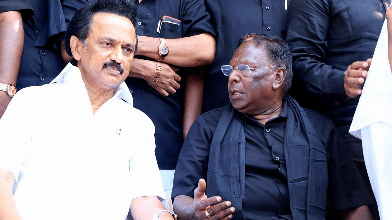  DMK President MK Stalin speaks with Puducherry Chief Minister V Narayanasamy. Credit: PTI Photo