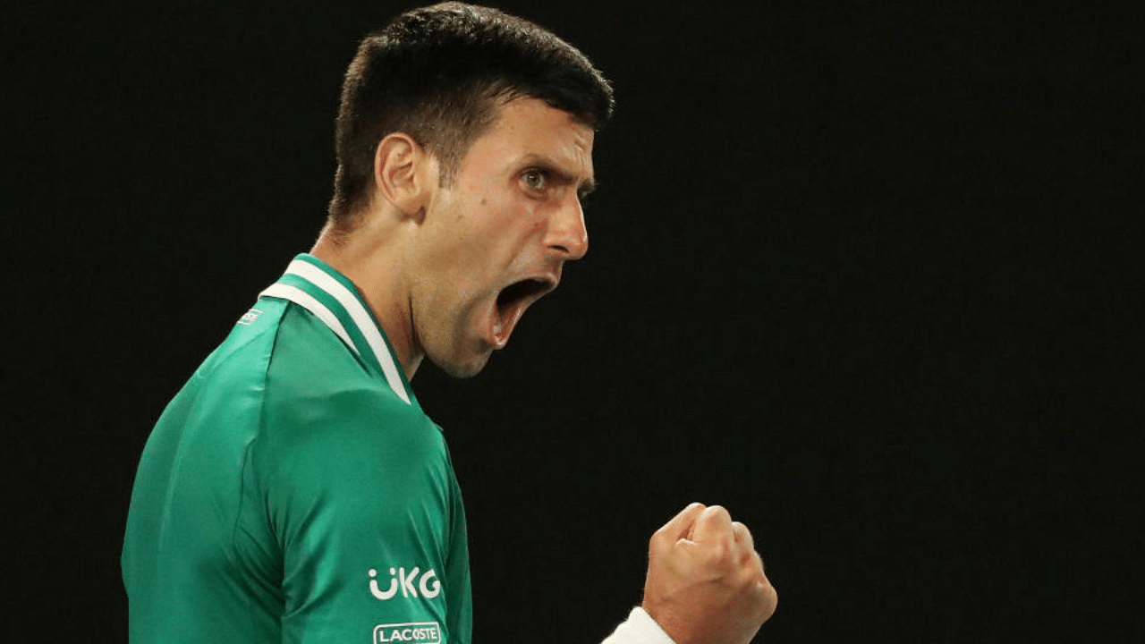  Serbia's Novak Djokovic celebrates winning the third set during his quarter final match against Germany's Alexander Zverev. Credit: Reuters Photo