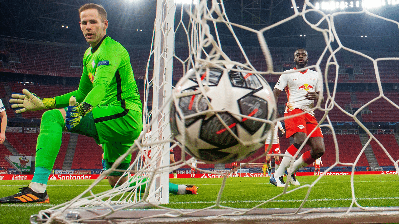 RB Leipzig's Hungarian goalkeeper Peter Gulacsi looks at the ball during the UEFA Champions League. Credit: AFP Photo