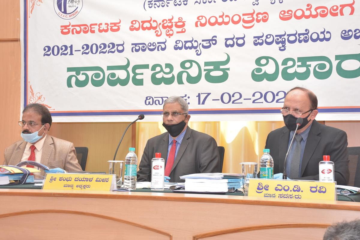 Shambhu Dayal Meena, Chairperson of Karnataka Electricity Regulatory Commission, chairs a meeting at the office of deputy commissioner in Mysuru on Wednesday. Member of the commission M D Ravi is seen. DH PHOTO