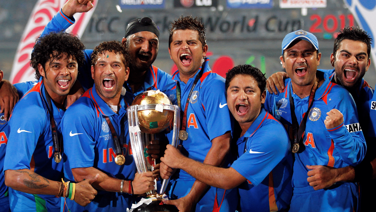 India's players celebrate with the trophy after winning ICC Cricket World Cup final match against Sri Lanka in Mumbai. Credit: Reuters File Photo