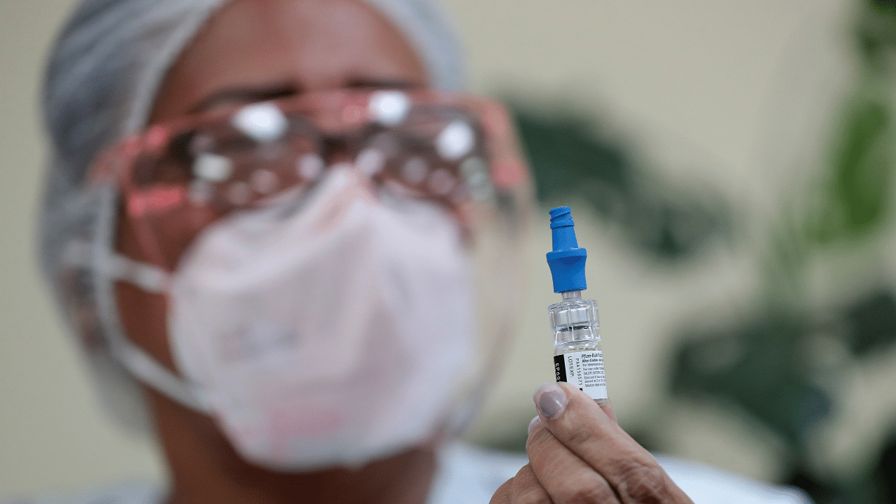 A nurse shows a vial of the Pfizer-BioNTech Covid-19 vaccine. Credit: Reuters Photo