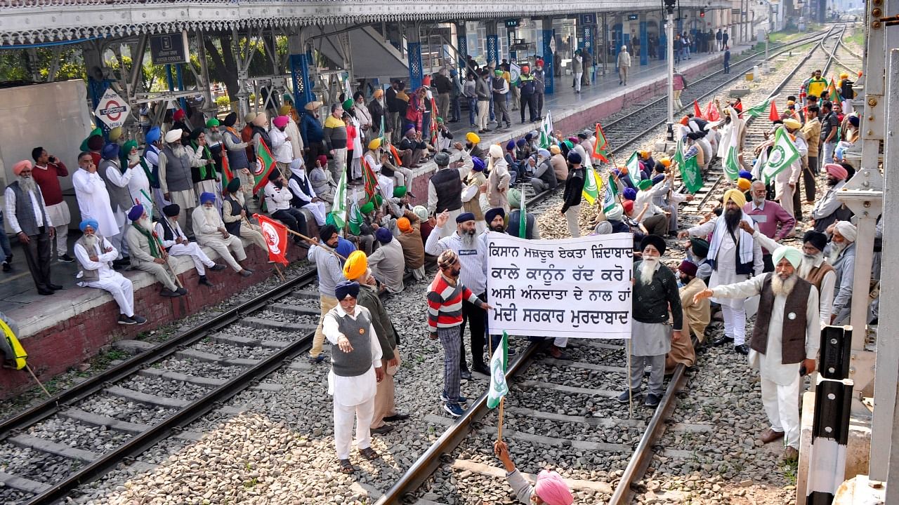 Members of various farmer organisations block a railway track during a four-hour 'rail roko' demonstration across the country in Patiala district, Punjab. Credit: PTI Photo