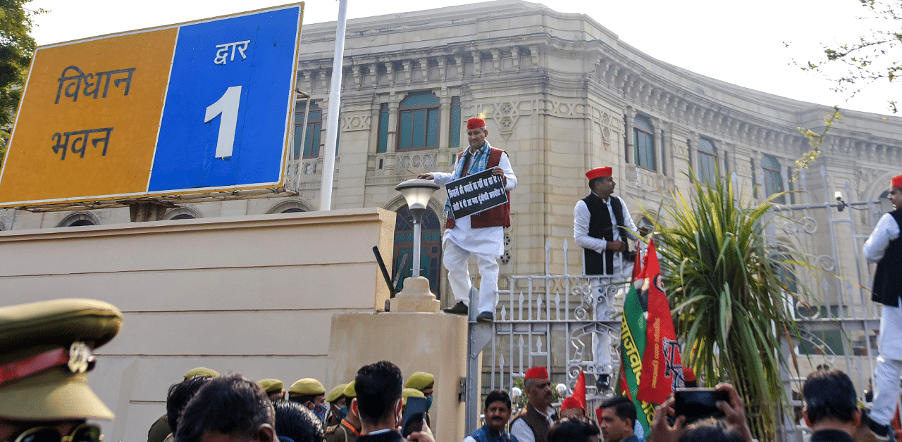 Samajwadi Party leaders stage a protest on the first day of the Budget Session of UP Assembly. Credit: PTI Photo