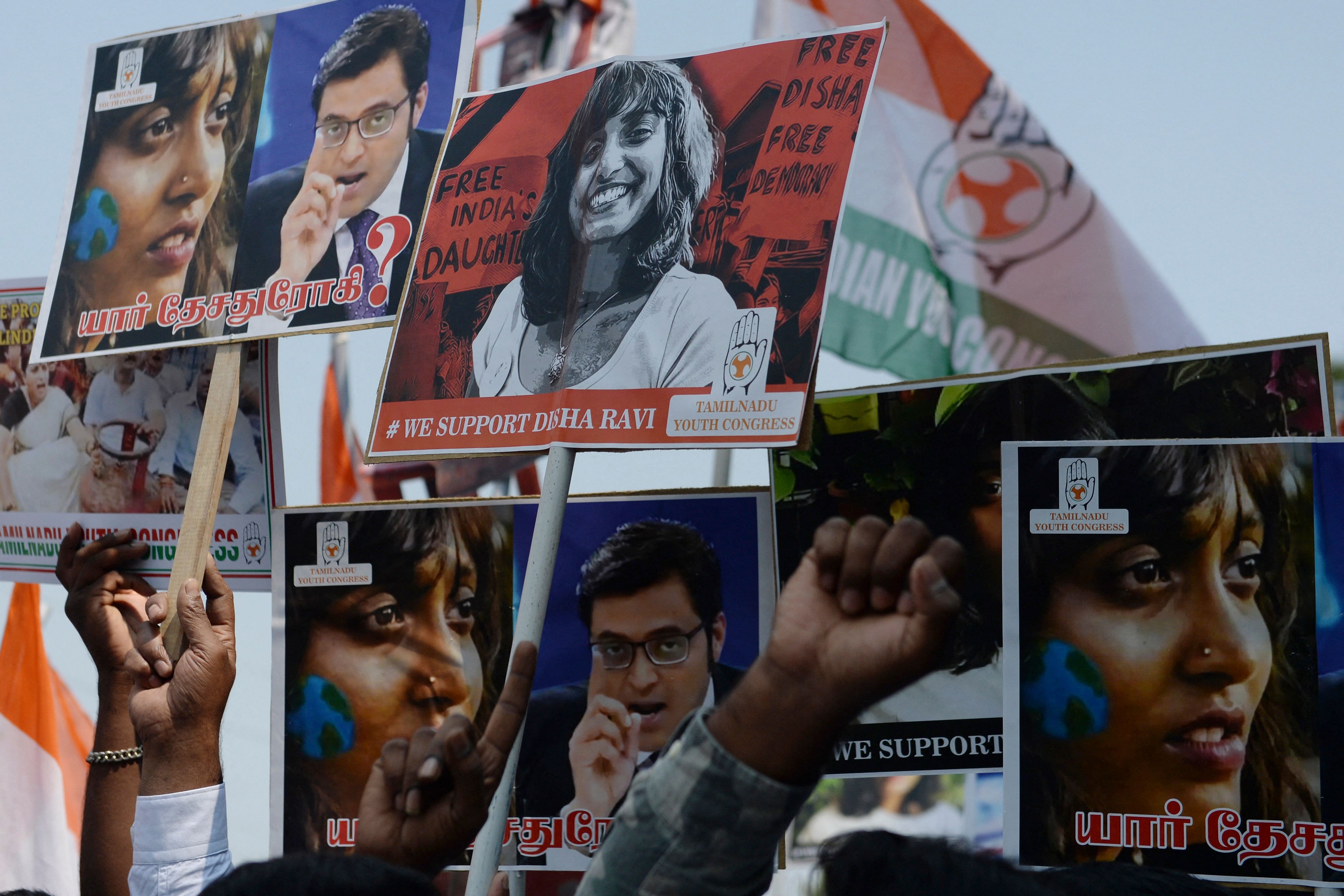 Members of the Indian Youth Congress hold pictures of activist Disha Ravi after her arrest by Delhi police for her alleged involvement in the instigation of violence during the farmers protest on India's Republic Day. Credit: AFP Photo