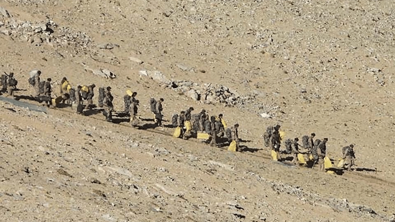 In this undated handout photograph released by the Indian Army on February 16, 2021 shows People Liberation Army (PLA) soldiers during military disengagement along the Line of Actual Control (LAC) at the India-China border in Ladakh. Credit: AFP 