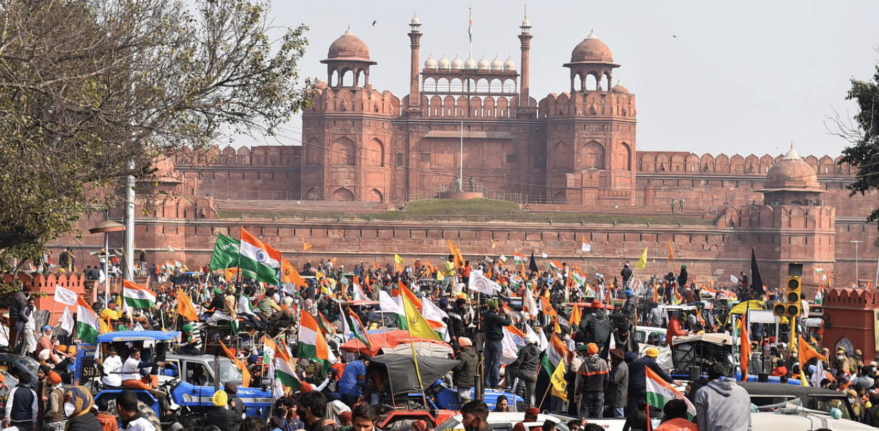 Farmers gather at Red Fort during their tractor parade on Republic Day, in New Delhi. Credit: PTI Photo