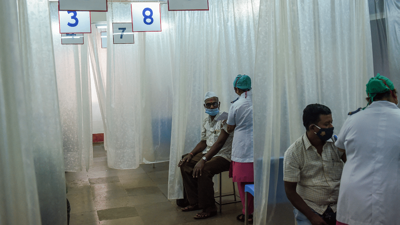 Medical staff inoculate civil authority workers with a Covid-19 coronavirus vaccine. Credit: AFP Photo