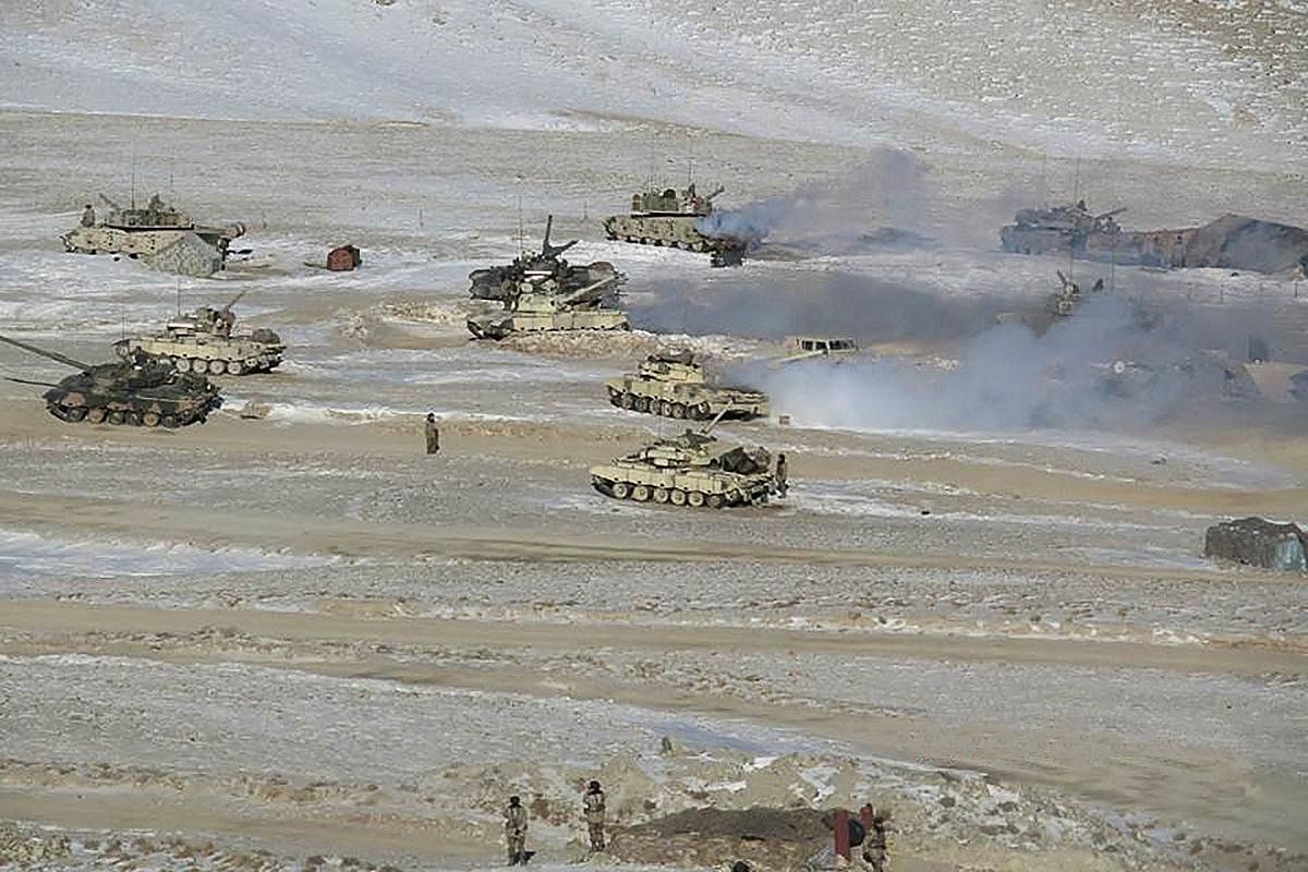 This undated handout photograph released by the Indian Army on February 16, 2021 shows People Liberation Army (PLA) soldiers and tanks during military disengagement along the Line of Actual Control (LAC) at the India-China border in Ladakh.