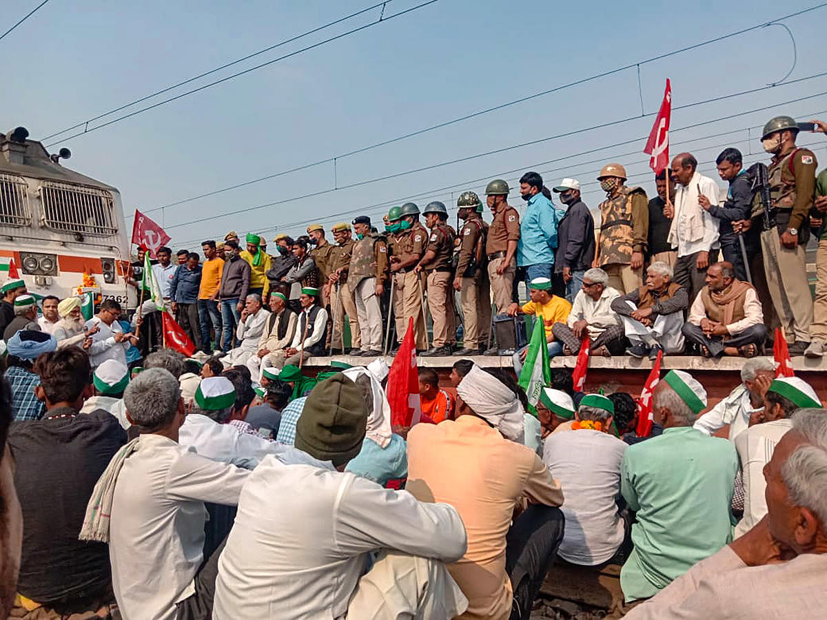 Members of various farmer organisations during a countrywide four-hour 'rail roko' demonstration, called by Samyukta Kisan Morcha (SKM), as part of their agitation against Centre's farm reform laws, in New Delhi, Thursday, Feb. 18, 2021. Credit: PTI Photo