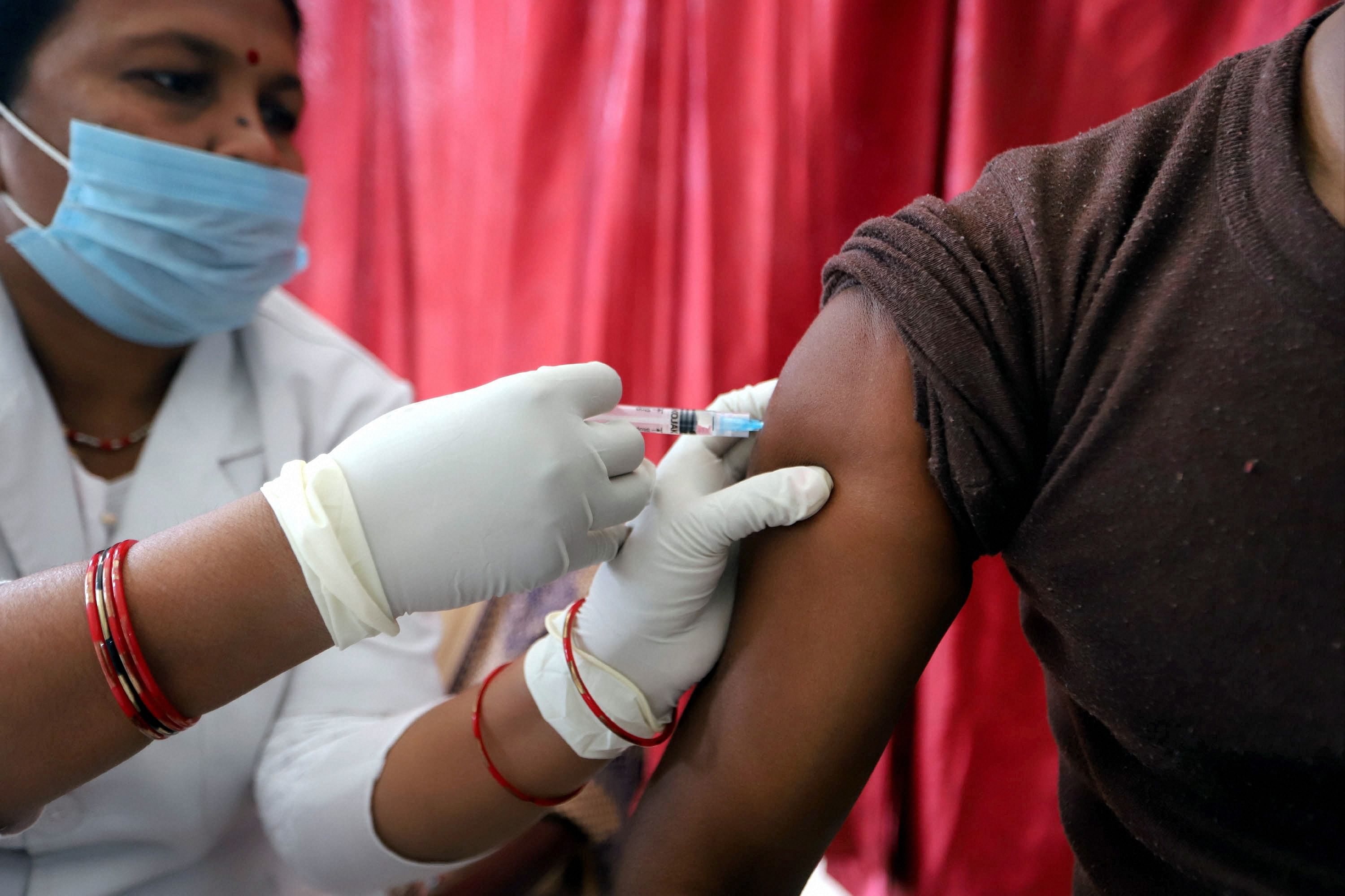 A medic administers second dose of Covishield vaccine during a COVID-19 inoculation drive, in Prayagraj, Friday, Feb. 19, 2021. Credit: PTI Photo